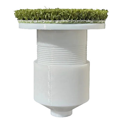 White cylindrical object with grass-like material on top against a white background