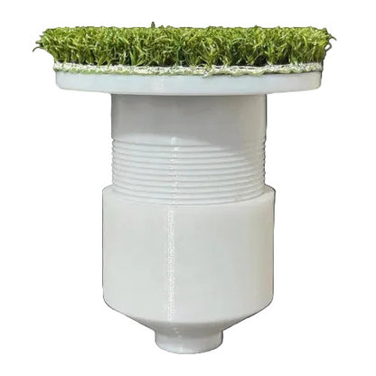 White cylindrical object with grass on top against a white background