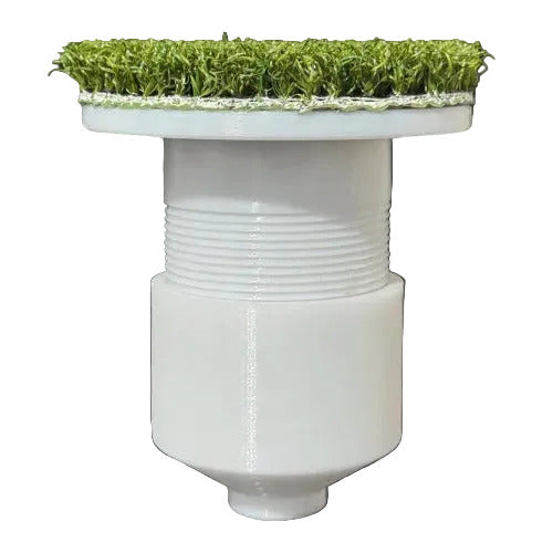White cylindrical object with grass on top against a white background